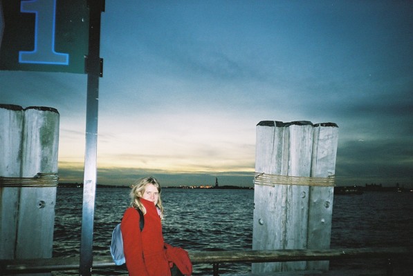 Charlotte feeling very cold in Battery Park - you can just see the Statue of Liberty in the background